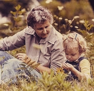 Sarah Wickers, founder of Well Seasoned Table with grandmother, Anna sitting in nature together